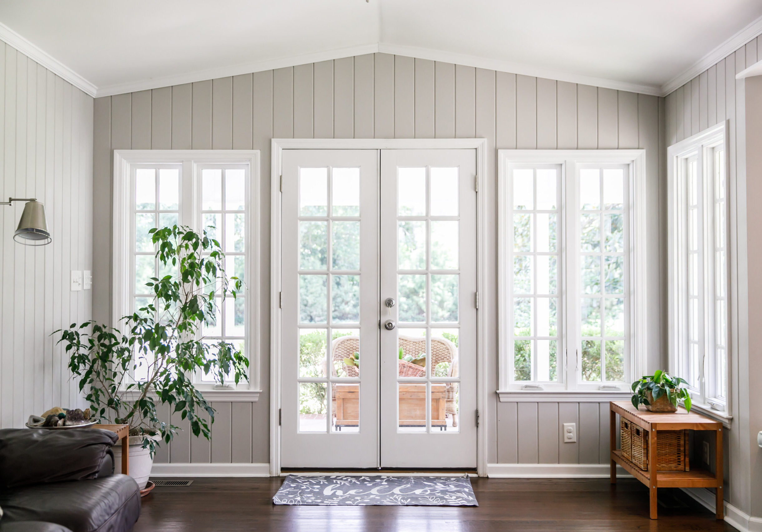 Large and open living room den sun room with windows on two side